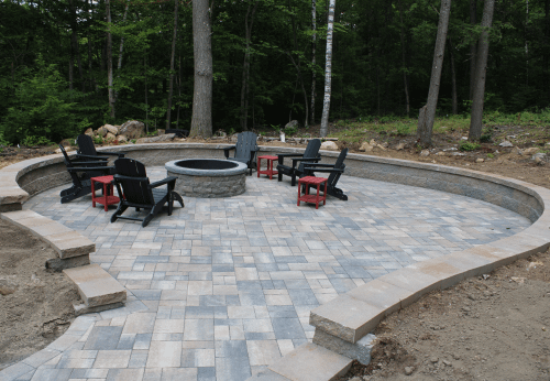 Stone retaining wall installation for landscape support and design