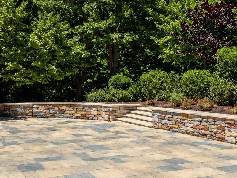 Masonry Hardscape design featuring a patio and decorative retaining wall